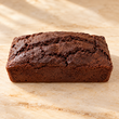 Max & Lucy's chocolate loaf on a warm neutral surface
