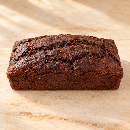 Max & Lucy's chocolate loaf on a warm neutral surface